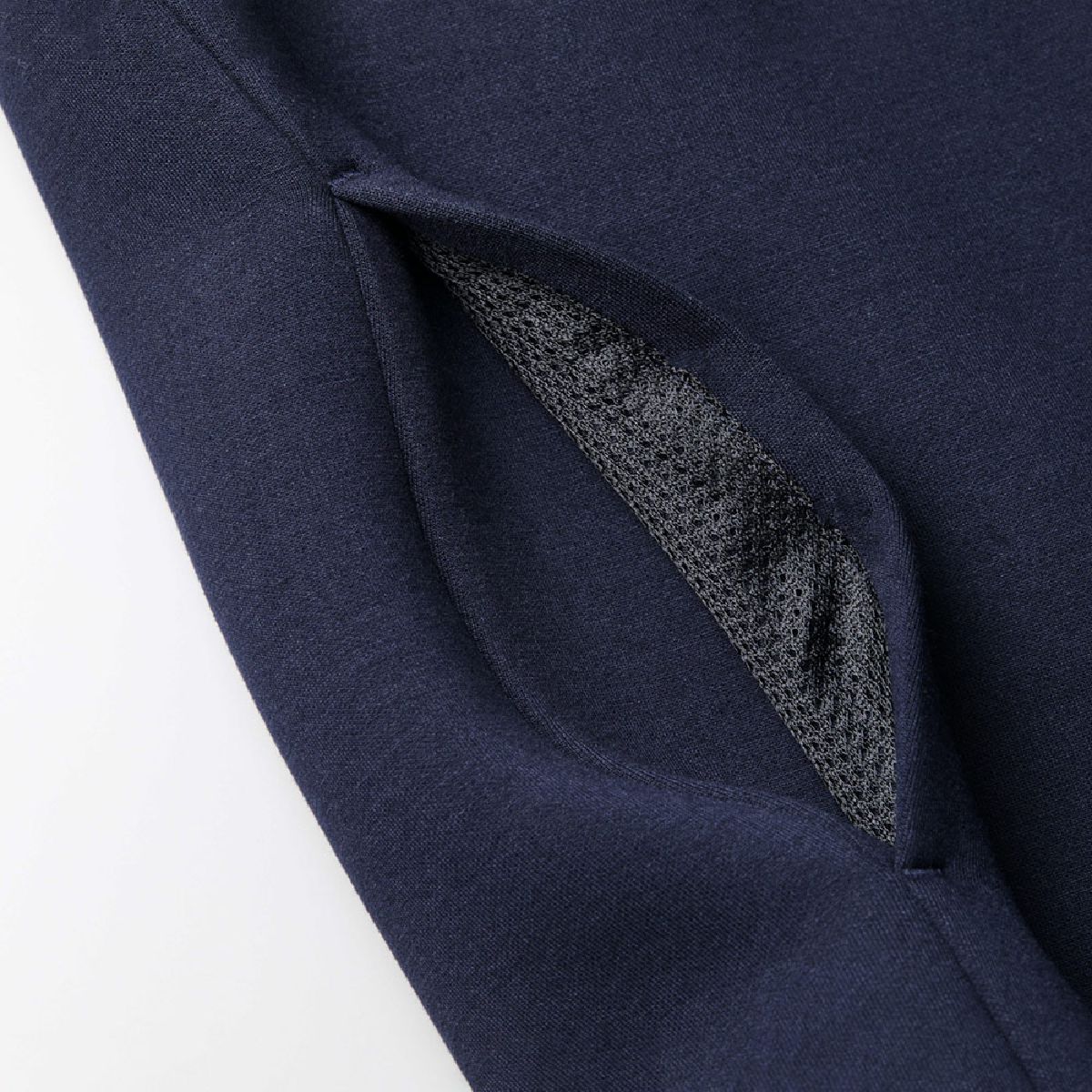 Seam pockets on the sides, black and navy mesh is used.
