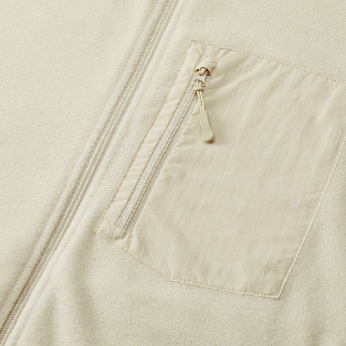 With a zipper -type nylon pocket on the left chest