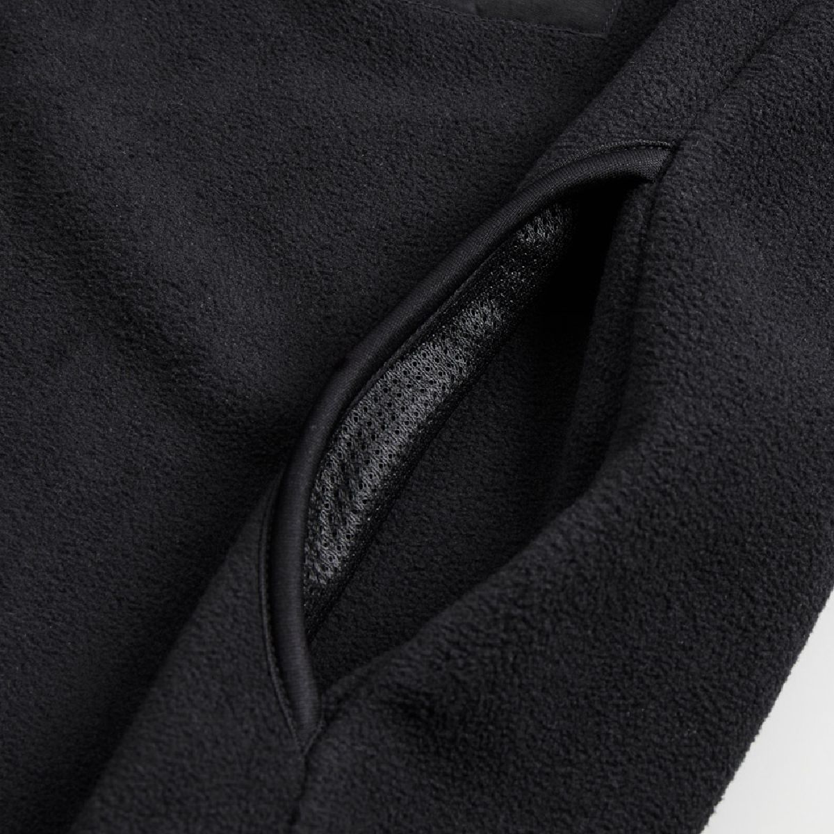 002. The black side pocket bag is made of black -colored mesh