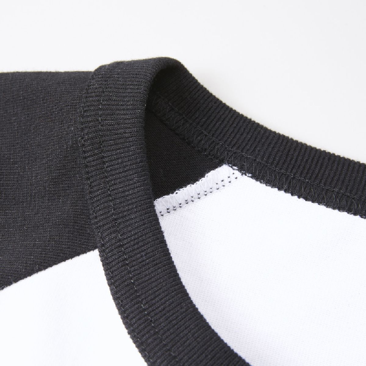 The neck ribbing is a double-needle binder finish.