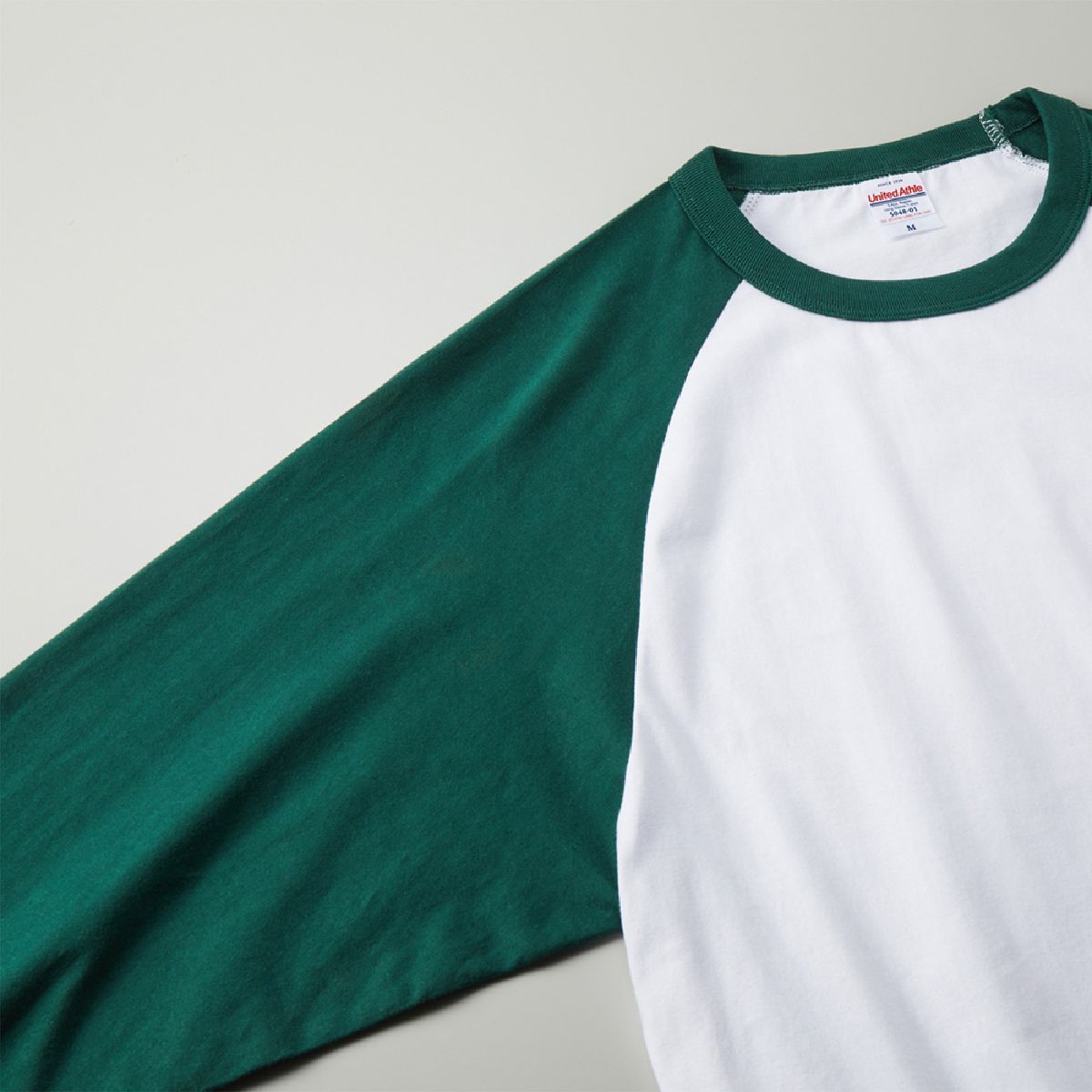 The armhole seam line is designed with a gentle S-shaped raglan sleeve at the front.
